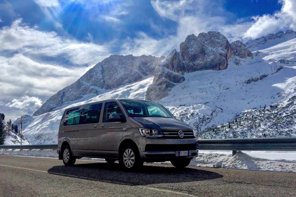 Van Volkswagen Caravelle at Passo Fedaia in Val di Fassa with the Marmolada on the background